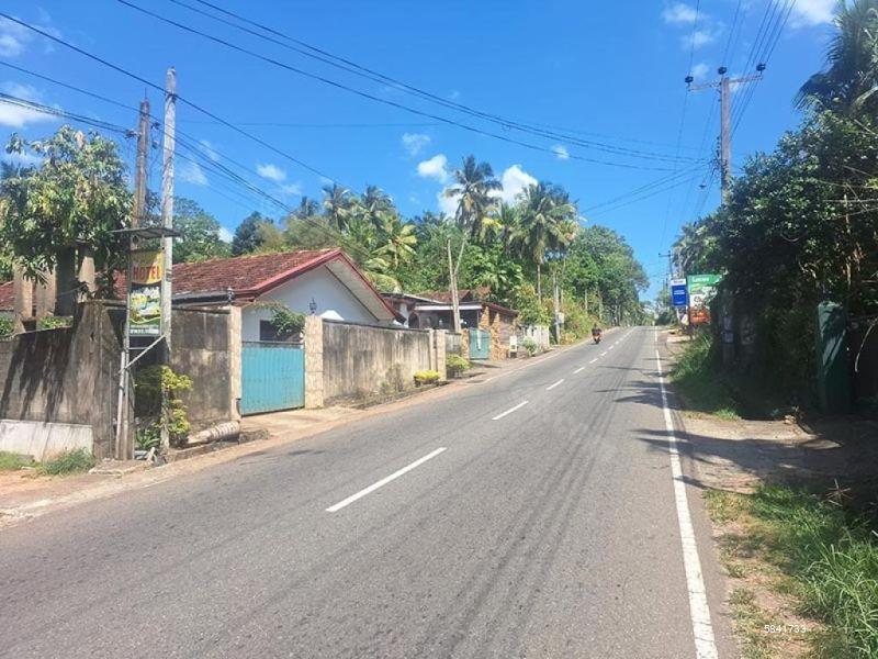 Land with house for sale in Udugampola