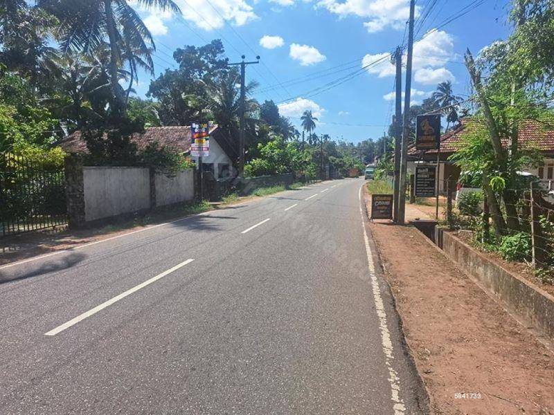 Land with house for sale in Udugampola