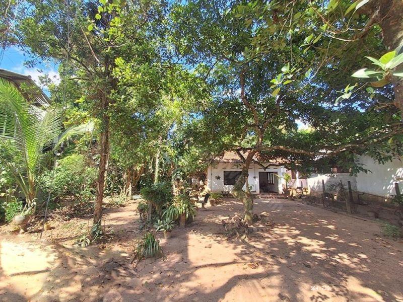 Land with house for sale in Udugampola