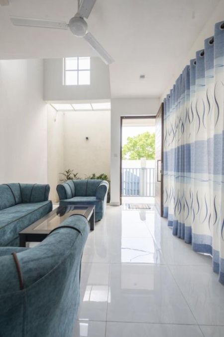 Living Room - Charming 2-Bedroom Santorini Villa with Resort Amenities for Short Term Rent